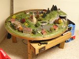 Made the table for my son. Formed the boarder wood by resawing pine strips. Did all the landscaping is scratch built.